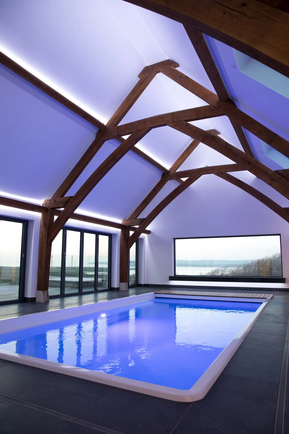 Green oak-framed swimming pool building