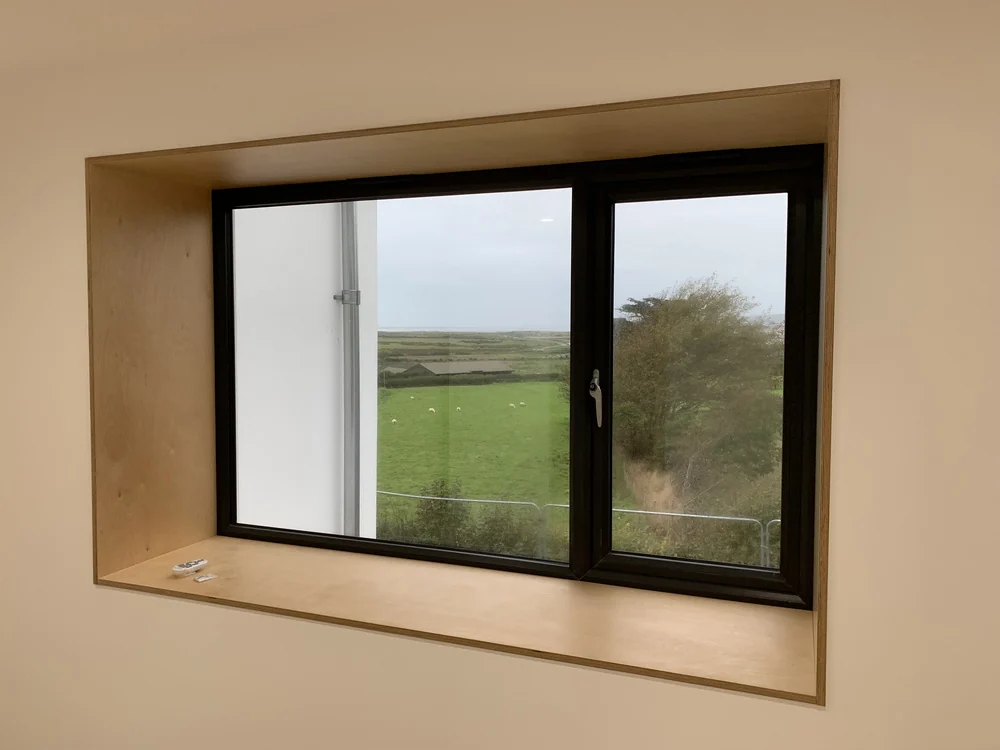 Plywood-framed window